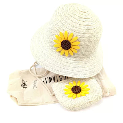 image shows a cream childrens panama hat with a bright yellow sunflower in the centre. Hat set also comes with a matching small cross body bag