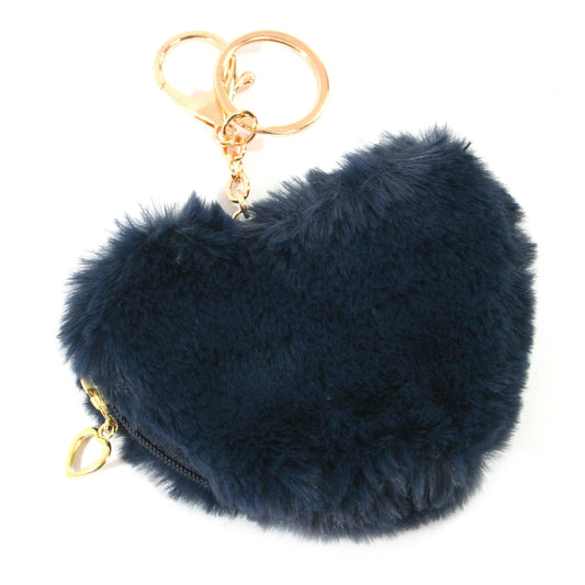 image shows a navy blue pom pom heart shaped keyring with gold hardwear