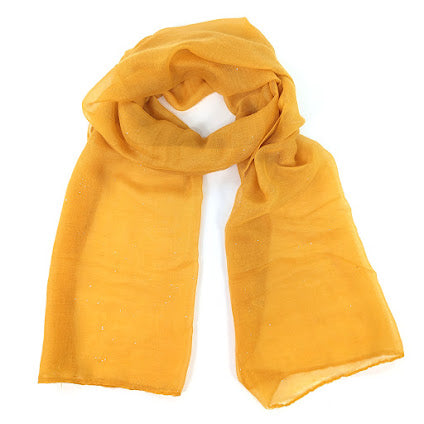 Image shows a lightweight mustard yellow scarf with subtle silver sparkle throughtout
