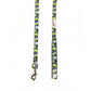 Image shows a lime green, grey, white and black paint splat design dog lead with silver hardwear and the white doodlebone logo