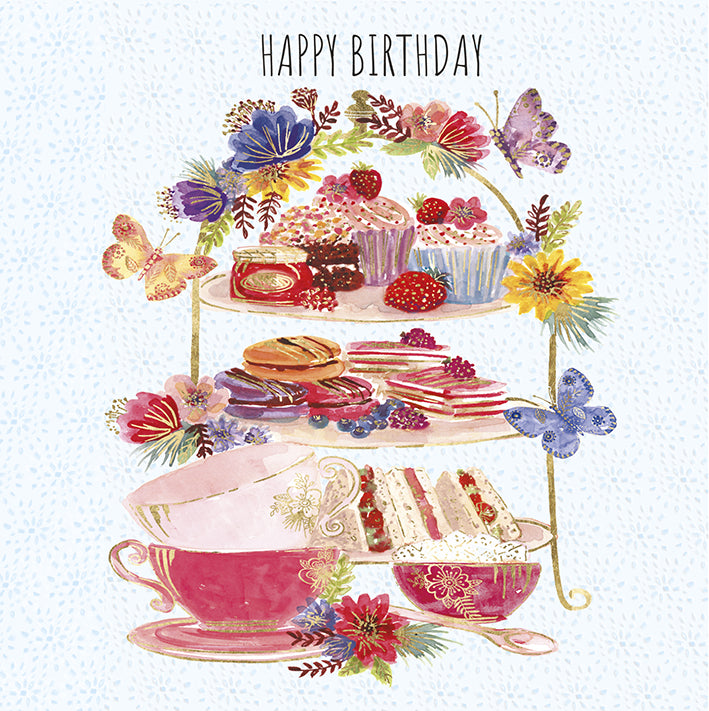 Image shows an afternoon tea style image with a birhgt floral design around the cake stand with a mixture of tea cakes and sandwhichs. card reads happy birthday