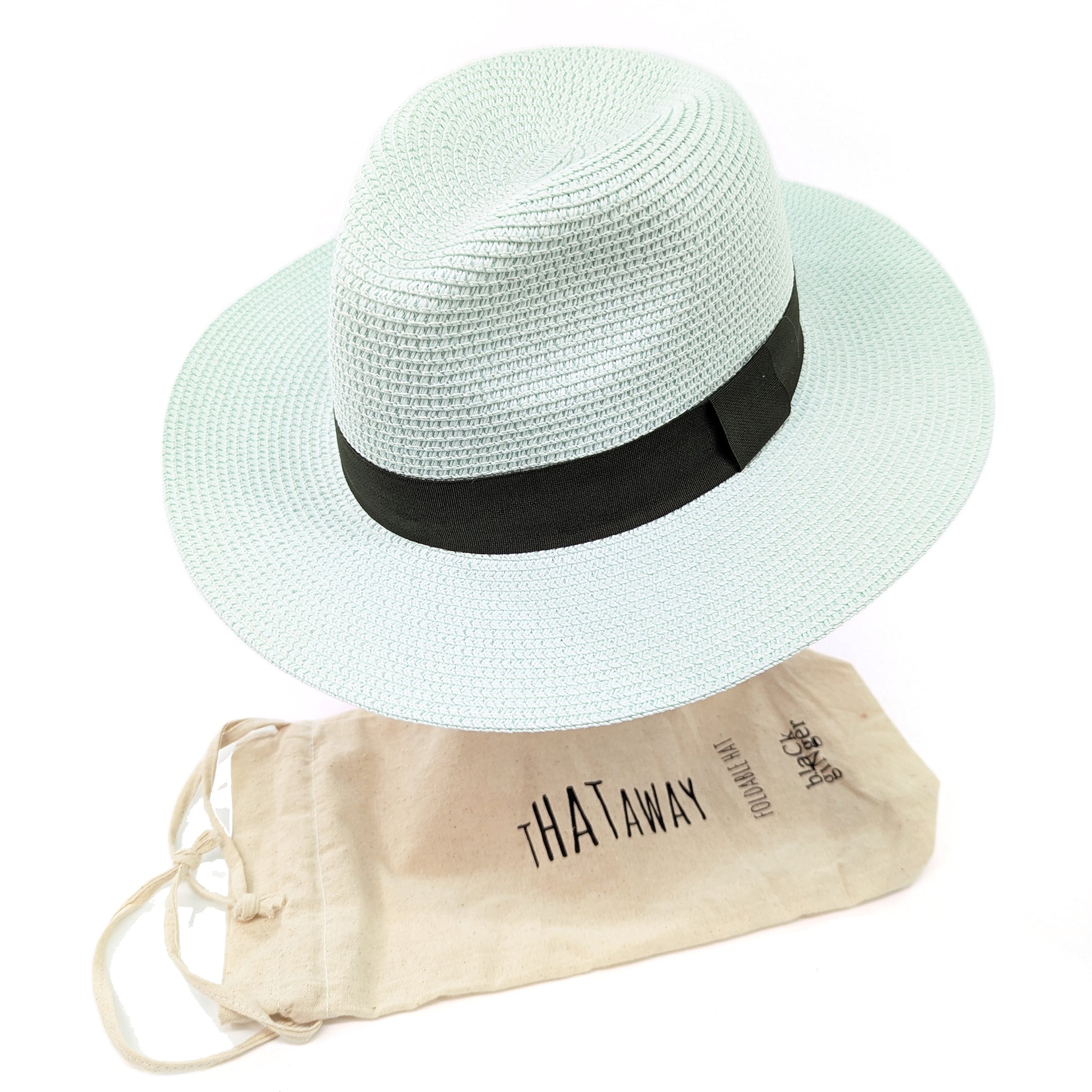 Image shows a mint green panama hat with a black ribbon around the centre