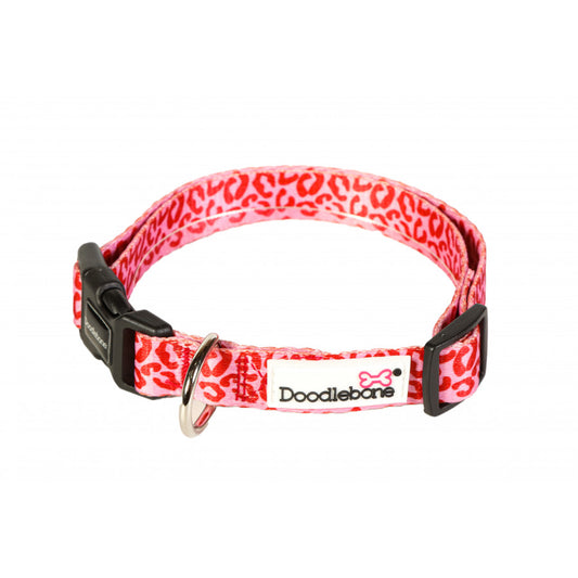 Image shows a bright red and pale pink leopard print design dog collar with silver and black hardwear and the white Doodlebone logo