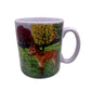 Image shows a white handled mug with a beautifully drawn image of our brown mule muffin standing in a grassy field with a line of autumnal colour trees which wraps around the mug