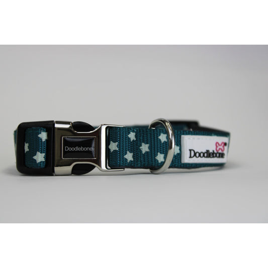Image shows a teal blue dog collar with light blue stars printed all the way round, finished off with silver and black hardwear.