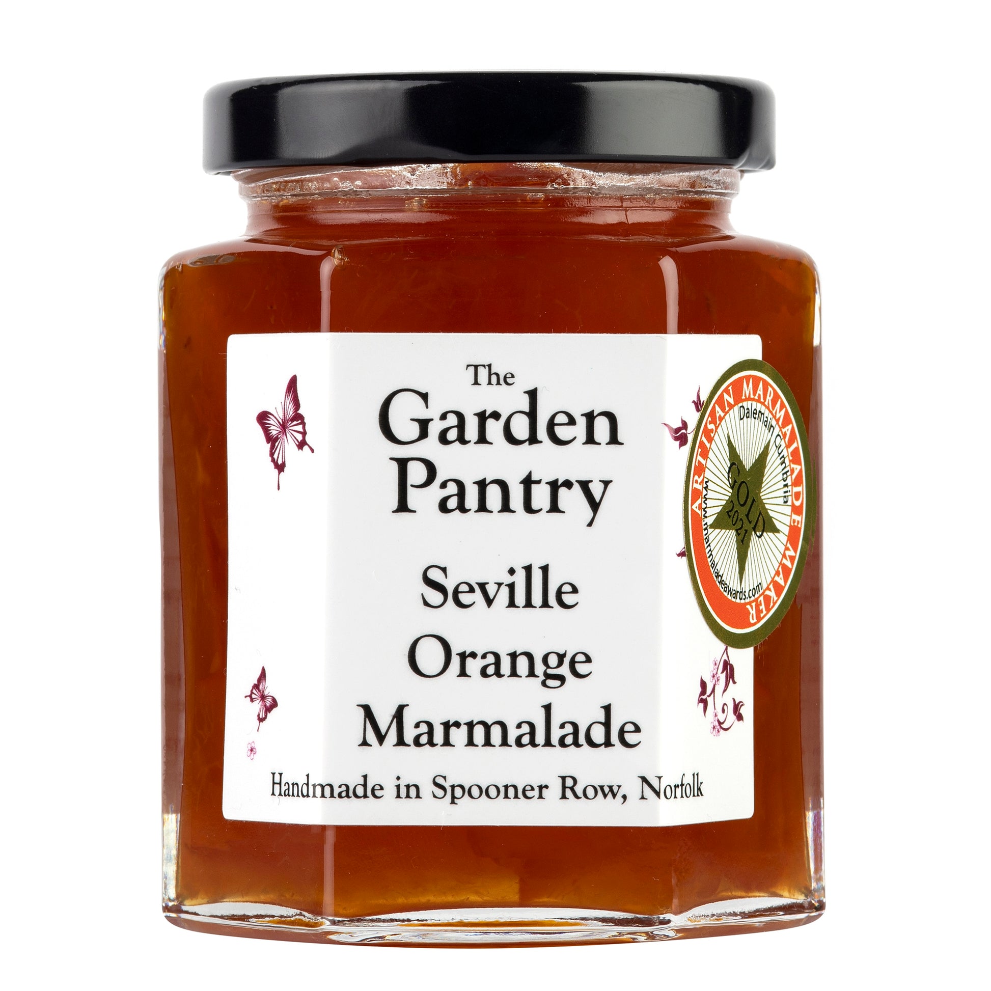 image shows a glass jar of seville orange marmalade witth a black lid.