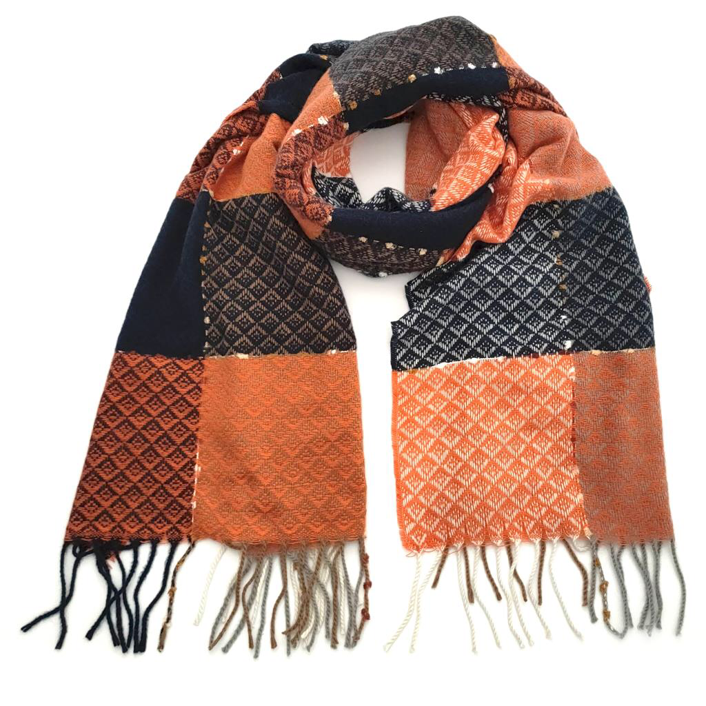 image shows a medium weight scarf with a mixture of orange and navy. Each square section has a criss cross pattern with alternate colours